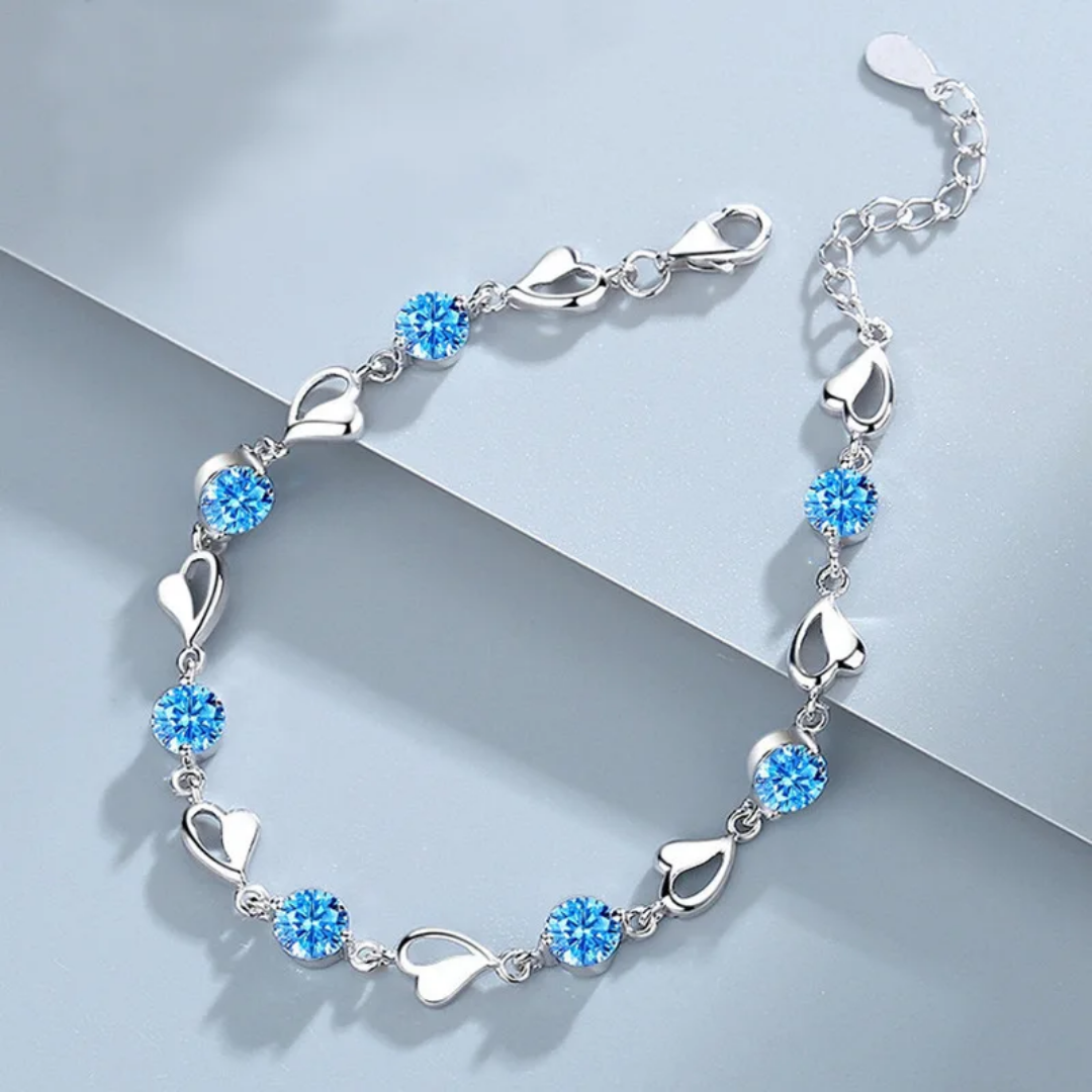 Elegant Silver Heart Charm Bracelet with Sparkling Blue Crystals