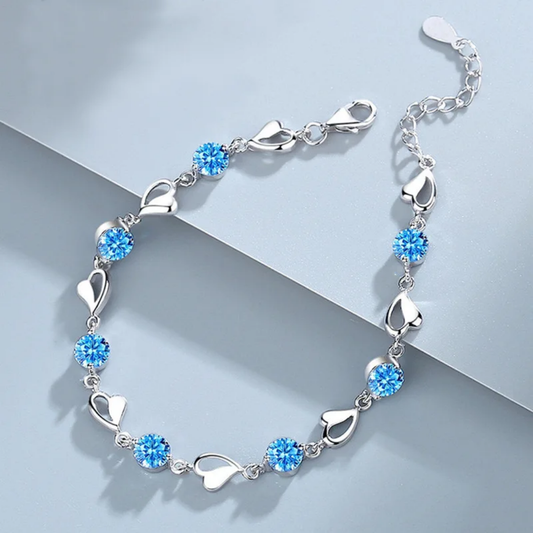 Elegant Silver Heart Charm Bracelet with Sparkling Blue Crystals