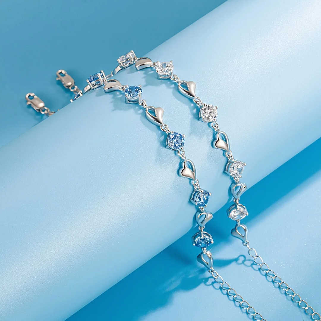 Elegant Silver Heart Charm Bracelet with Sparkling Blue Crystals