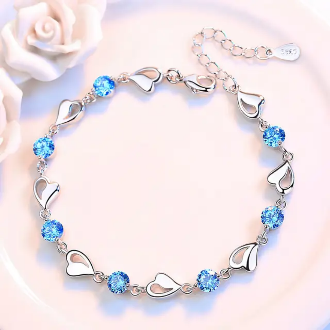 Elegant Silver Heart Charm Bracelet with Sparkling Blue Crystals